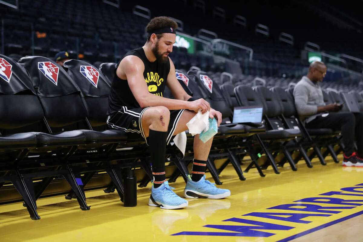 Klay Thompson sits on the bench after working out before Warriors game against the Portland Trail Blazers at Chase Center in San Francisco last month.