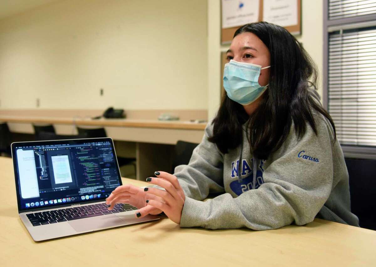 DHS junior Victoria Caruso shows the coding of her new app Blossom at Darien High School in Darien, Conn. Wednesday, Dec. 15, 2021. Caruso won the Congressional App Challenge for Connecticut District 4 by creating Blossom, a wellness app that allows users to track their progress towards building healthy habits such as exercise, sleeping more, and drinking more water.