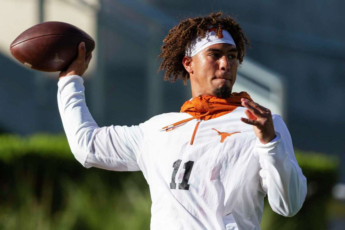 Texas quarterback Casey Thompson (11) warms up before an NCAA college football game against Baylor, Saturday, Oct. 30, 2021, in Waco, Texas. (AP Photo/Sam Hodde)