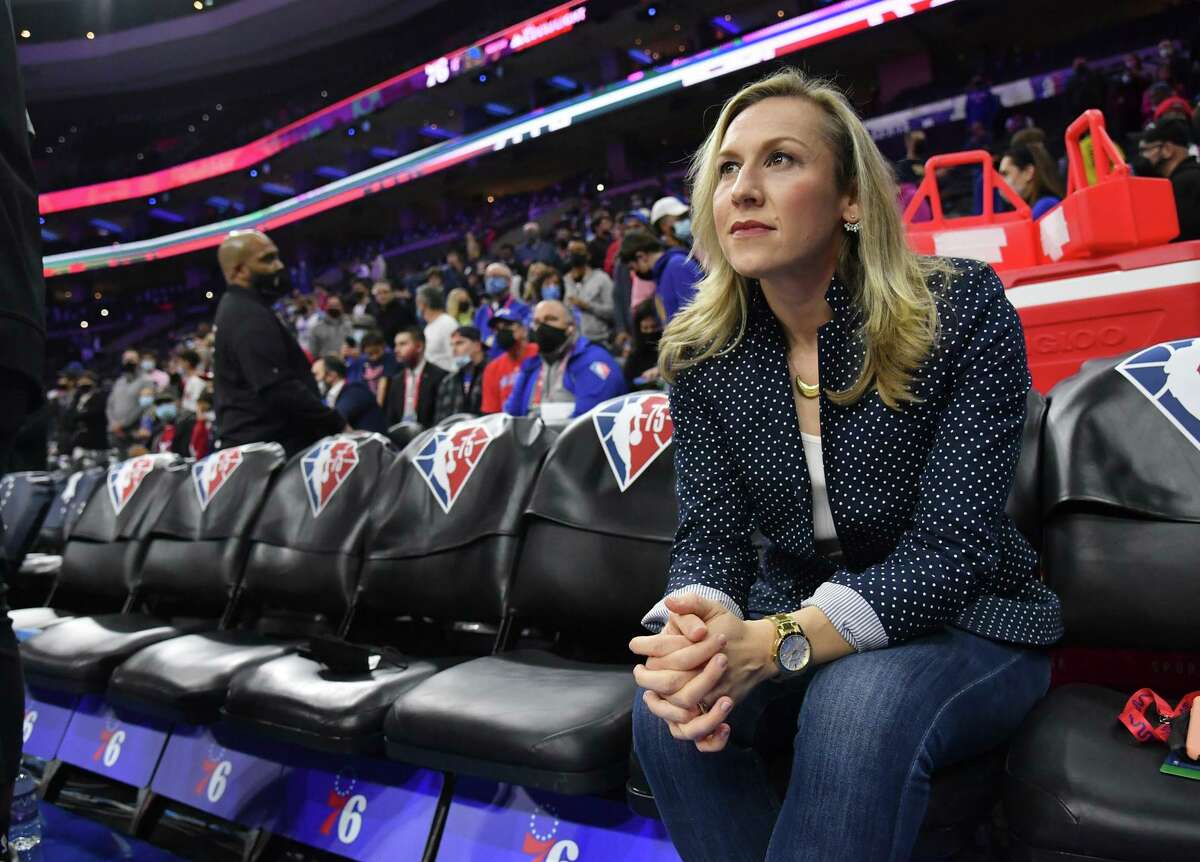 Philadelphia 76ers play-by-play announcer Kate Scott sits on the bench at Wells Fargo Center before the Sixers faced the Golden State Warriors in Philadelphia, Pa., on Dec. 11, 2021.