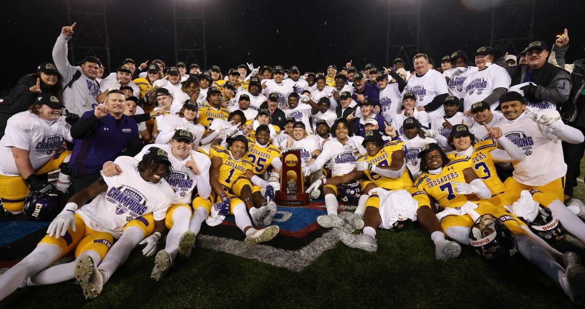 The Mary Hardin-Baylor Crusaders celebrate after defeating the the North Central Cardinals to win the Division III Mens Football Championship held at Tom Benson Hall of Fame Stadium on December 17, 2021 in Canton, Ohio. (Photo by Justin Tafoya/NCAA Photos via Getty Images)