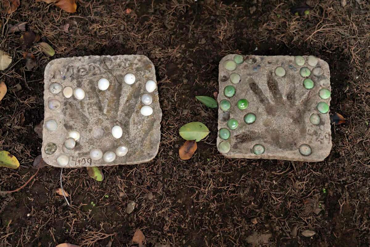 Hand prints of Fernando Sanchez and his half sister Angelique Sanchez are placed in Sanchez's memory garden at his mother Lisa Marquez's house on Saturday, Nov. 13, 2021 in Gilroy, Calif.