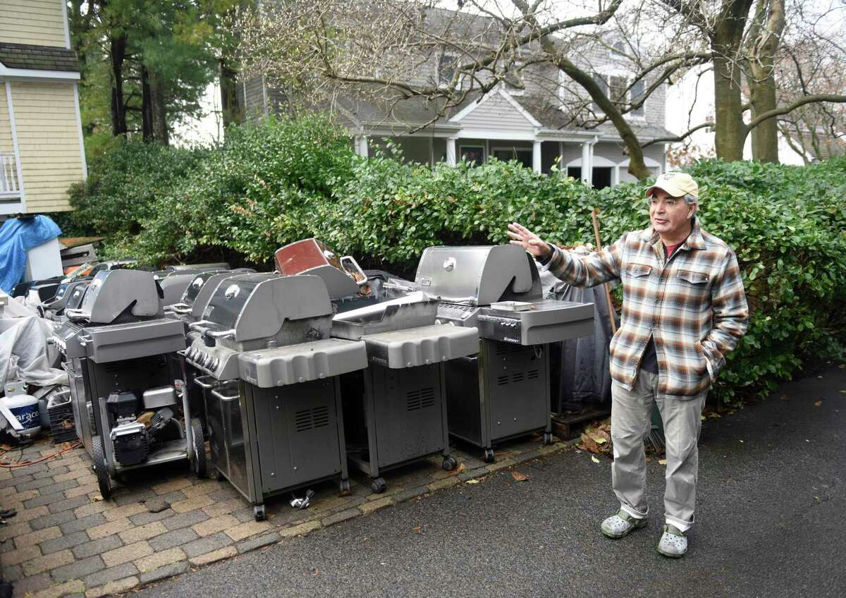 Bruce Angiolillo is concerned about the conditions at his neighbor's property on Random Road in Old Greenwich, Conn. Monday, Dec. 6, 2021. Neighbors say they have been trying to get the issue resolved for many years, but there has been no accountability.