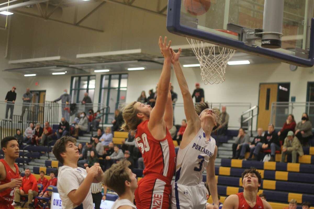 Benzie Central's Michael Wooten scores inside during the Huskies' 84-31 win over Onekama.