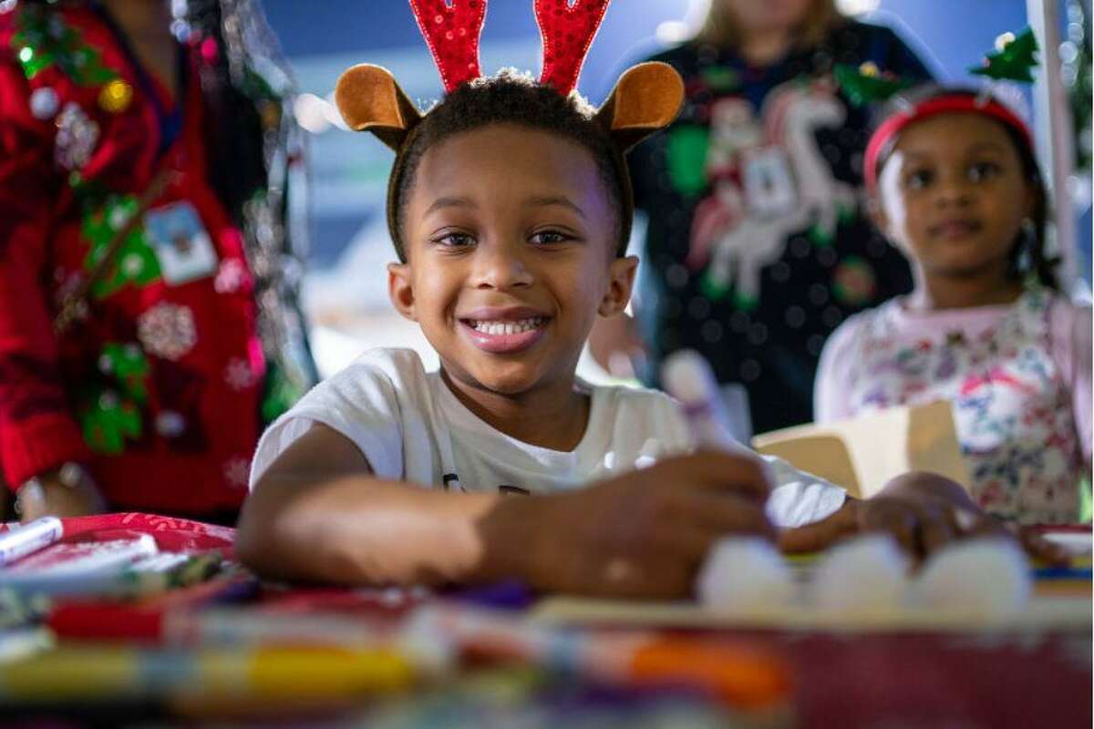Spring ISD students partake in activities at the district's annual Winter Wonderland reading event at Planet Ford Stadium