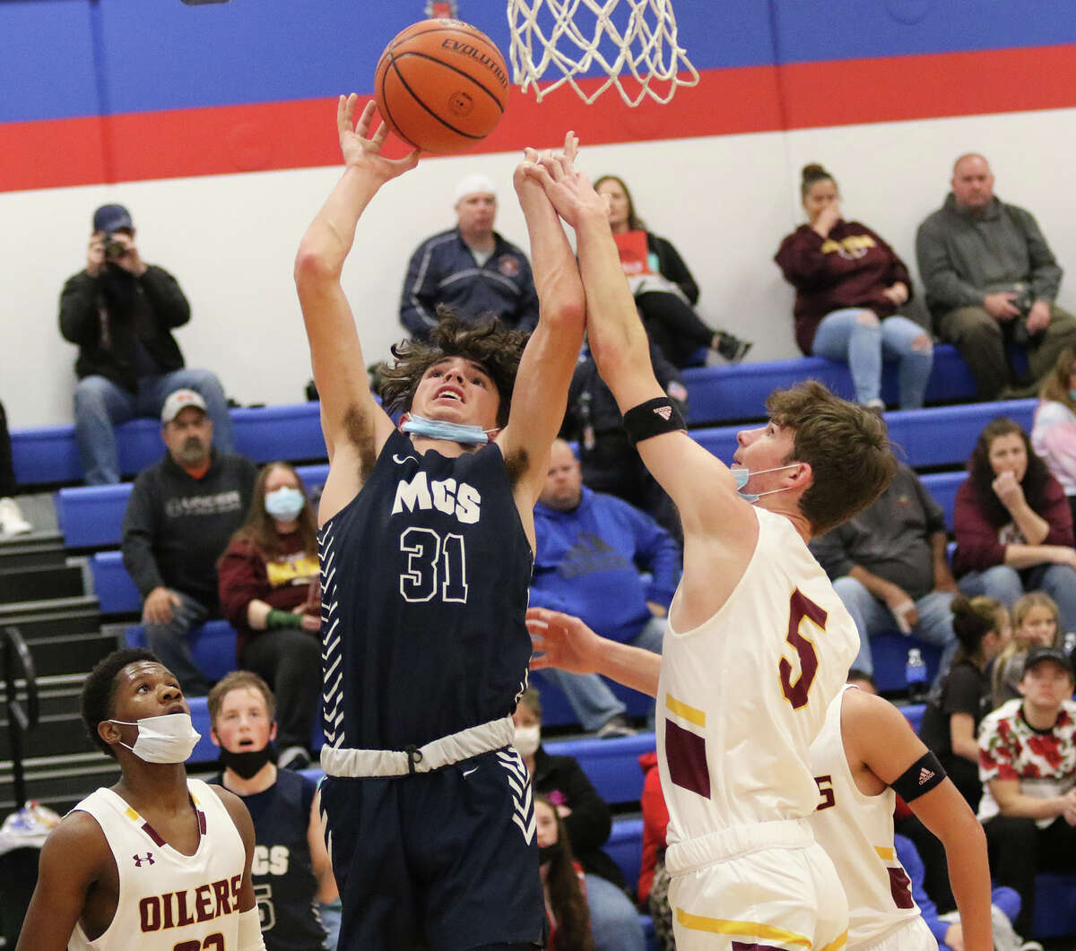 EA-WR's Zach Lybarger (5) blocks a hot by Maryville Christian's Dawson Hendrick during a Roxana Tourney game last month. On Friday night back at Roxana, the Oilers picked up a Cahokia Conference win over the Shells.