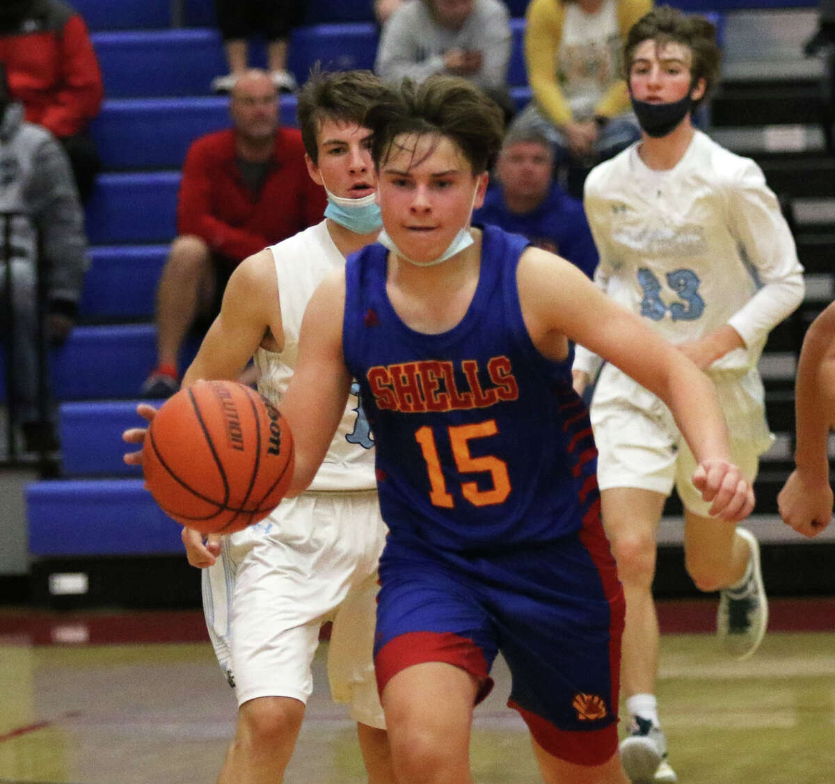 Roxana's Chris Walleck (15) pushes the ball upcourt in a game last month against Jersey at the Roxana Tourney. The Shells were at home Friday, playing their first game since Nov. 30 because of covid exposure, and lost to EA-WR. It was the Oilers' first game since Dec. 1.