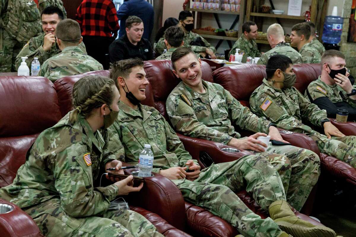 Soldiers from Joint Base San Antonio-Fort Sam Houston relax in the USO Lounge at San Antonio International Airport as they wait for holiday flights home.