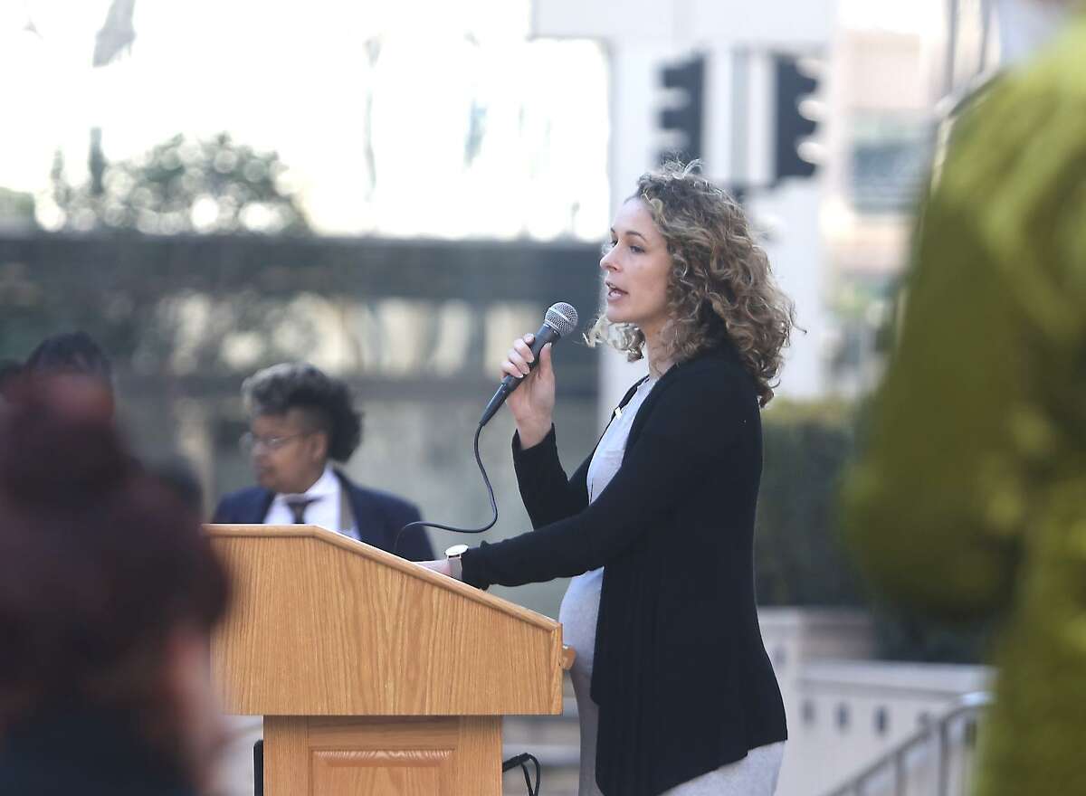 Kristi Palmer, co-founder of Kiva Confections, calls for tax relief for cannabis businesses impacted by targeted robberies during an appearance in Oakland last month.