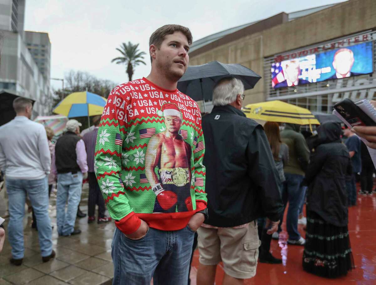 Dustin Krantz, 34, of Cypress, waits in line to enter the Toyota Center, where former President Donald Trump and former Fox News personality Bill O’Reilly held a Q&A session Saturday.