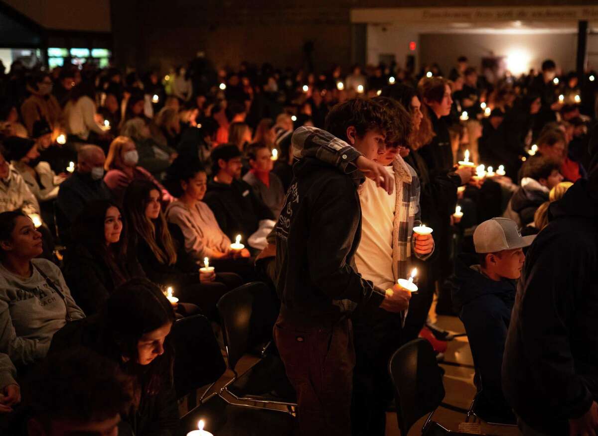 Oxford High School students who were present during the school shooting stand during a prayer vigil at LakePoint Community Church in Oxford, Michigan following an active shooter situation at Oxford High School on Tuesday, Nov. 30, 2021. Police took a suspected shooter into custody and there were multiple victims, the Oakland County Sheriff's office said.