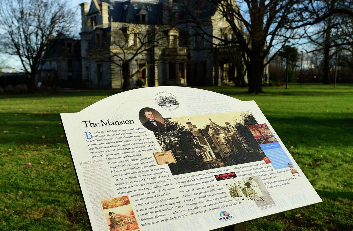 New signage outside Lockwood-Mathews Mansion Saturday, December 18, 2021, in Norwalk, Conn. The new signs describes the history of the house and its grounds.