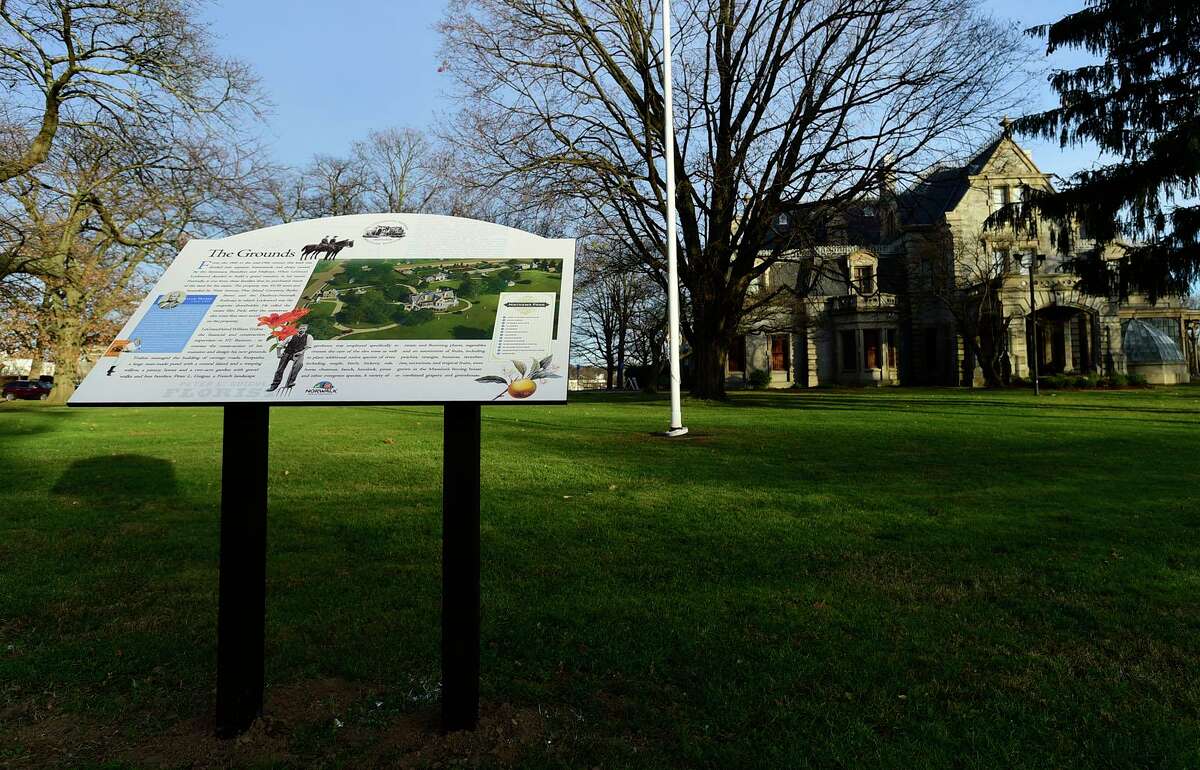 New signage outside Lockwood-Mathews Mansion Saturday, December 18, 2021, in Norwalk, Conn. The new signs describes the history of the house and its grounds.