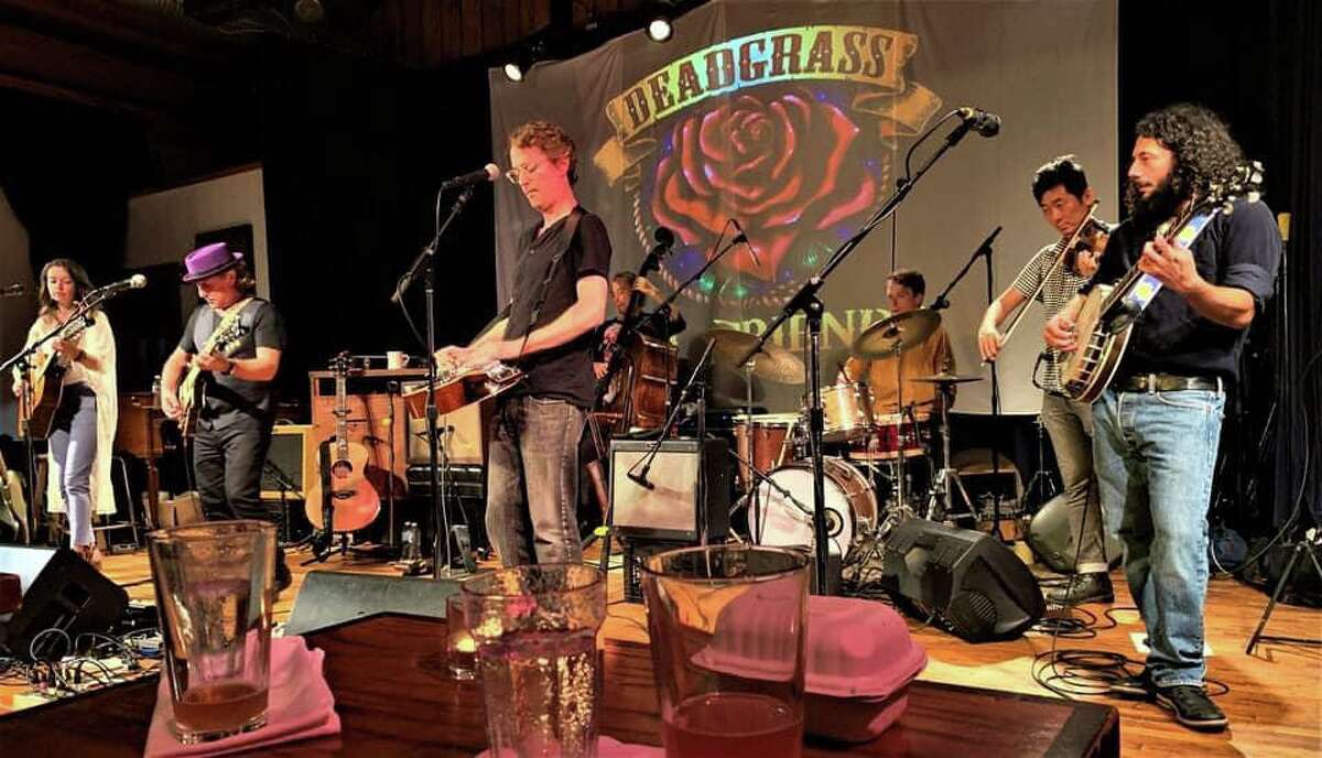 The Milford Art Council has announced a Deadgrass double show on Saturday, Jan. 8, 2022, at 7 p.m., and 9:30 p.m. at the Milford Arts Center building in Milford. Deadgrass is a string band adventure through guitarist Jerry Garcia’s musical world. Deadgrass will be doing two distinct shows as the five piece string band that also consists of: Russ Gottlieb on the banjo, Kensuke Shoji on the fiddle, C. Joseph Lanzbom on guitars, David Richards on bass, and yours truly, Jerry Garcia, on the mandolin, acoustic guitar, and singing vocals. The members of the Deadgrass string band are shown.