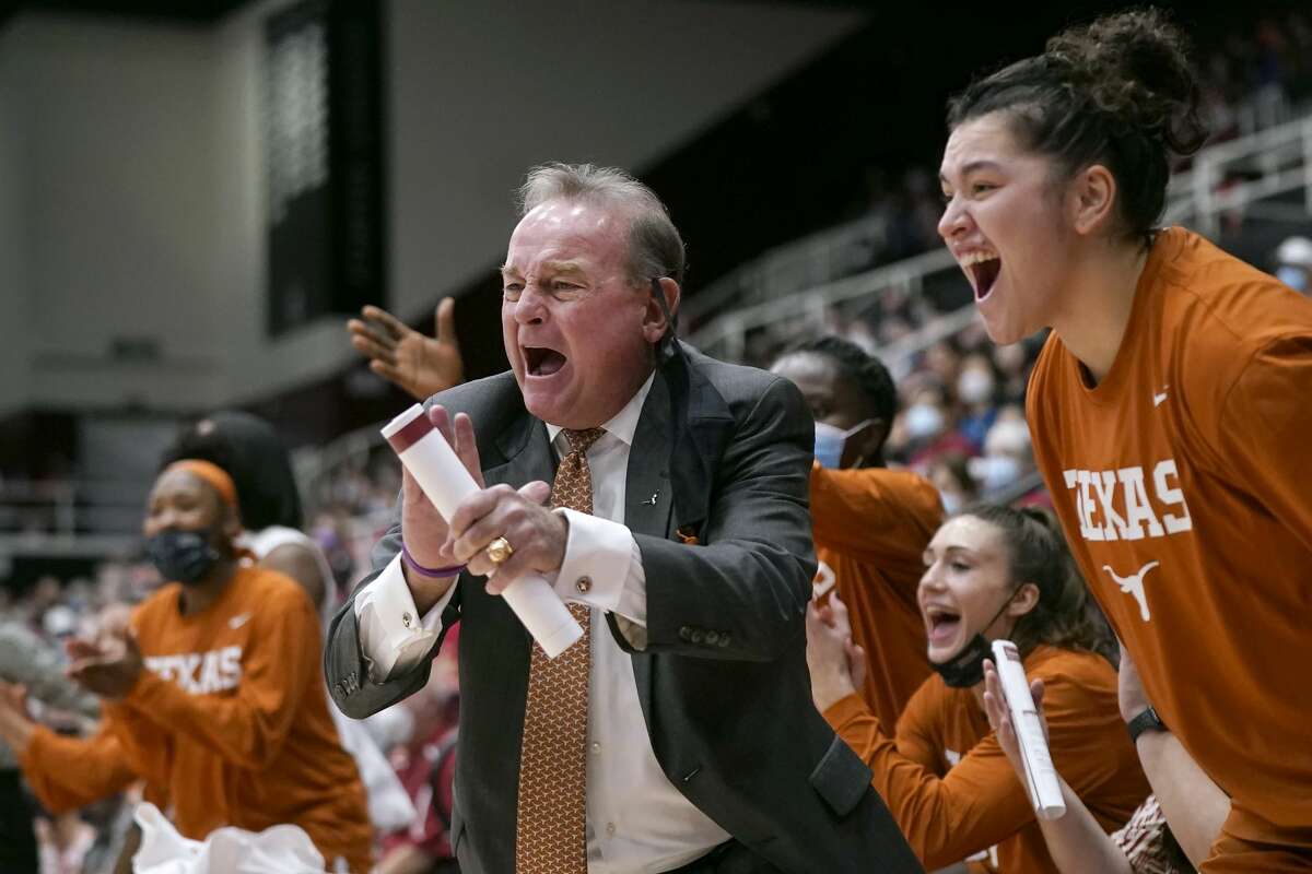 Texas head coach Vic Schaefer, middle, reacts toward players during the first half of his team's NCAA college basketball game against Stanford in Stanford, Calif., Sunday, Nov. 14, 2021. (AP Photo/Jeff Chiu)