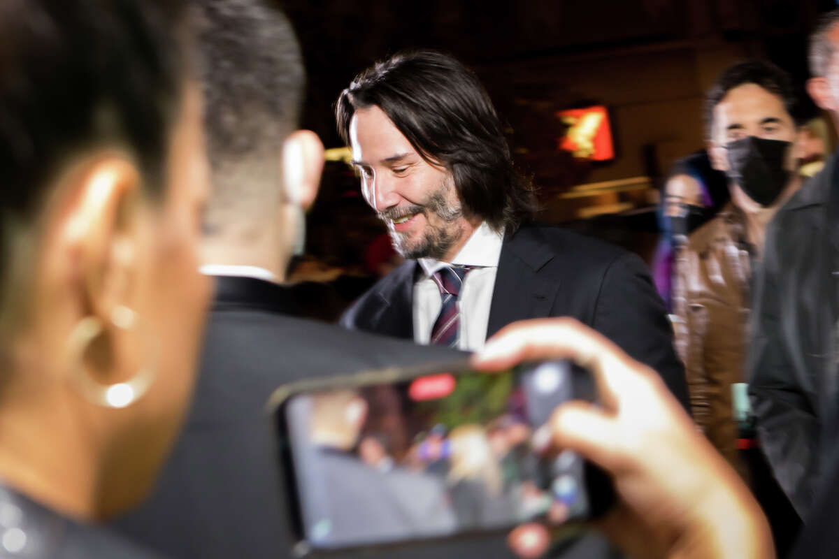 Keanu Reeves greeting fans at the Matrix Resurrections Premiere at The Castro Theater in San Francisco, Calif. on Dec. 18, 2021.