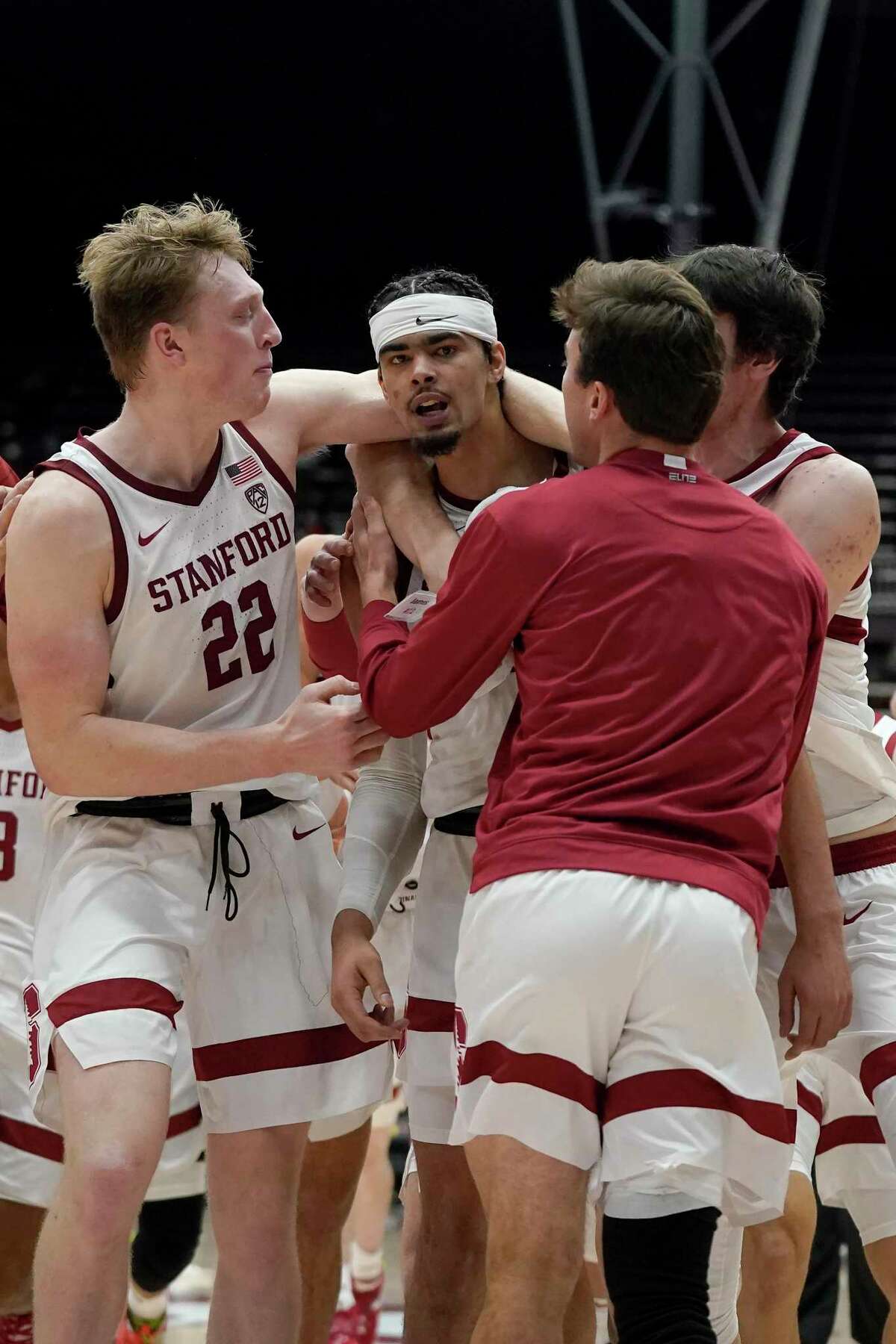 Stanford forward Jaiden Delaire, middle, celebrates with teammates after Stanford beat Oregon on Dec. 12.