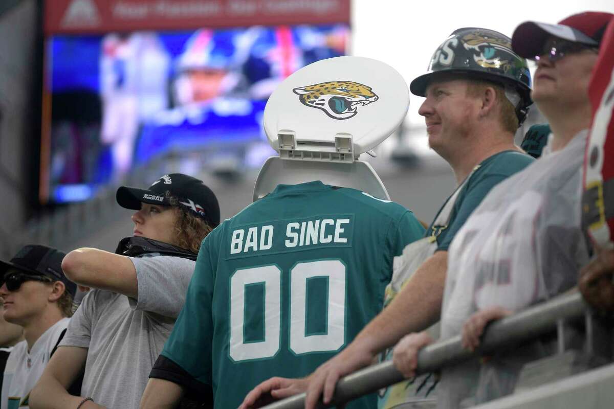 Sad Jaguars fan wears toilet seat over head during Texans' win