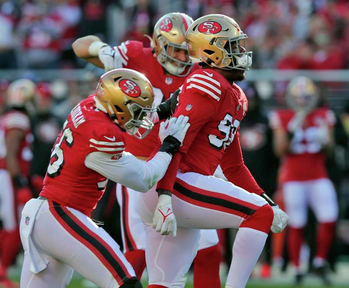 The defense celebrates a sack by Arden Key (98) in the first half as the San Francisco 49ers played the Atlanta Falcons at Levi’s Stadium in Santa Clara, Calif., on Sunday, December 19, 2021.