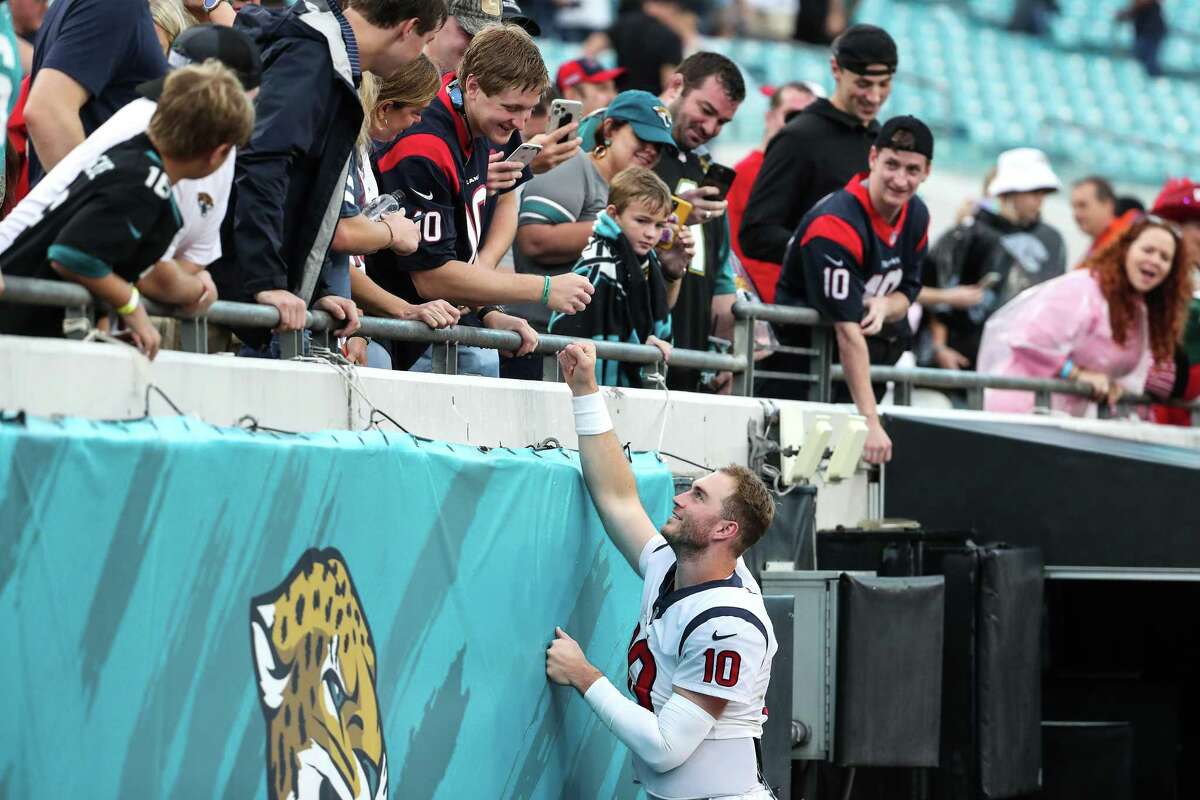 Houston Texans quarterback Davis Mills (10) greets friends and family after picking up his first win as a starter in a 30-16 Texans win over the Jacksonville Jaguars.