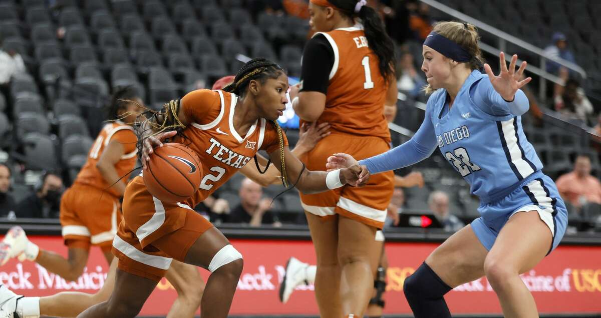 Aliyah Matharu #2 of the Texas Longhorns drives against Kasey Neubert #22 of the San Diego Toreros during the Pac-12 Coast-to-Coast Challenge at T-Mobile Arena on December 19, 2021 in Las Vegas, Nevada. The Longhorns defeated the Toreros 74-58. (Photo by Ethan Miller/Getty Images)
