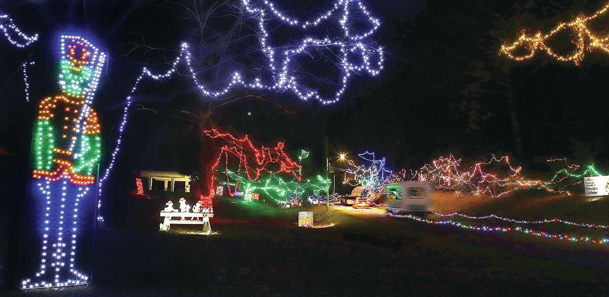 John Badman|The Telegraph Christmas Wonderland lights up the night sky in Alton's Rock Spring Park. The drive through light display is erected each year by the volunteer group of mostly retired tradesmen known as the Grandpa Gang.