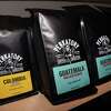 Bags of whole bean coffee sold at Perkatory Coffee Roasters in Branford on December 13, 2021.