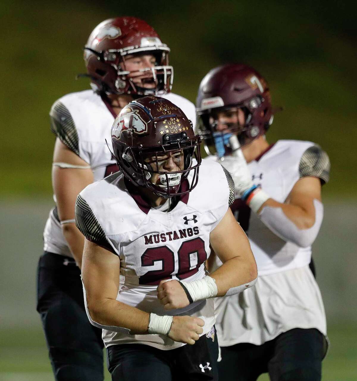 Magnolia West running back Hunter Bilbo (20) reacts after converting a fourth down during the fourth quarter of a high school football game at Randall Reed Stadium, Friday, Oct. 29, 2021, in New Caney. Magnolia West defeated New Caney 31-24.