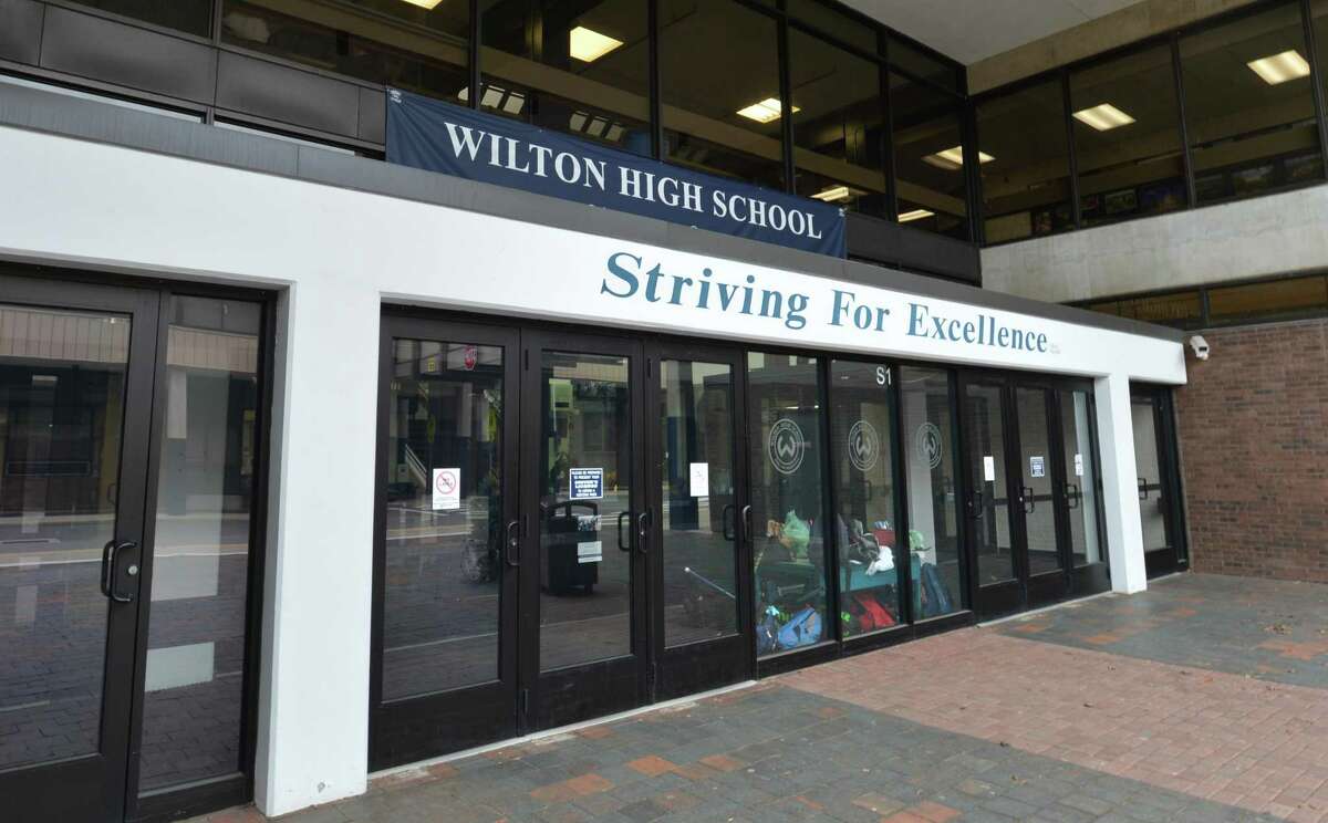 The front doors of Wilton High School welcomed students on Monday who had the choice to enter with or without masks after the state handed the decision off to local school districts in February.