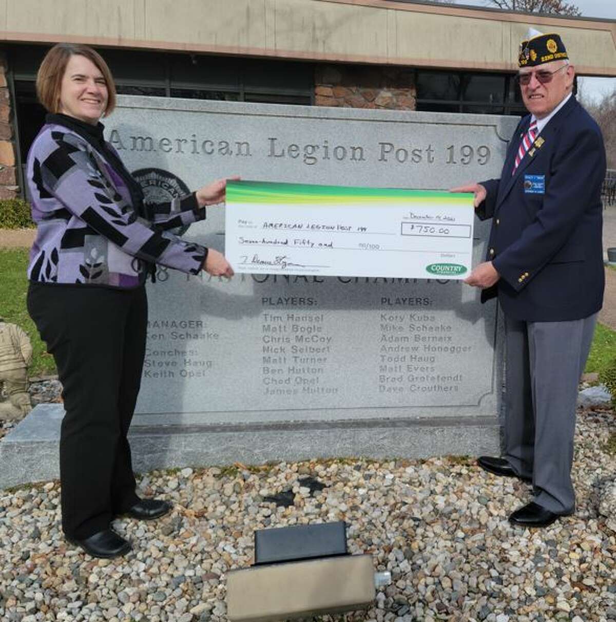 COUNTRY Financial Representative V. Deanne Stegeman, left, presents a $750 donation to Ron Swaim, commander of American Legion Edwardsville Post 199.