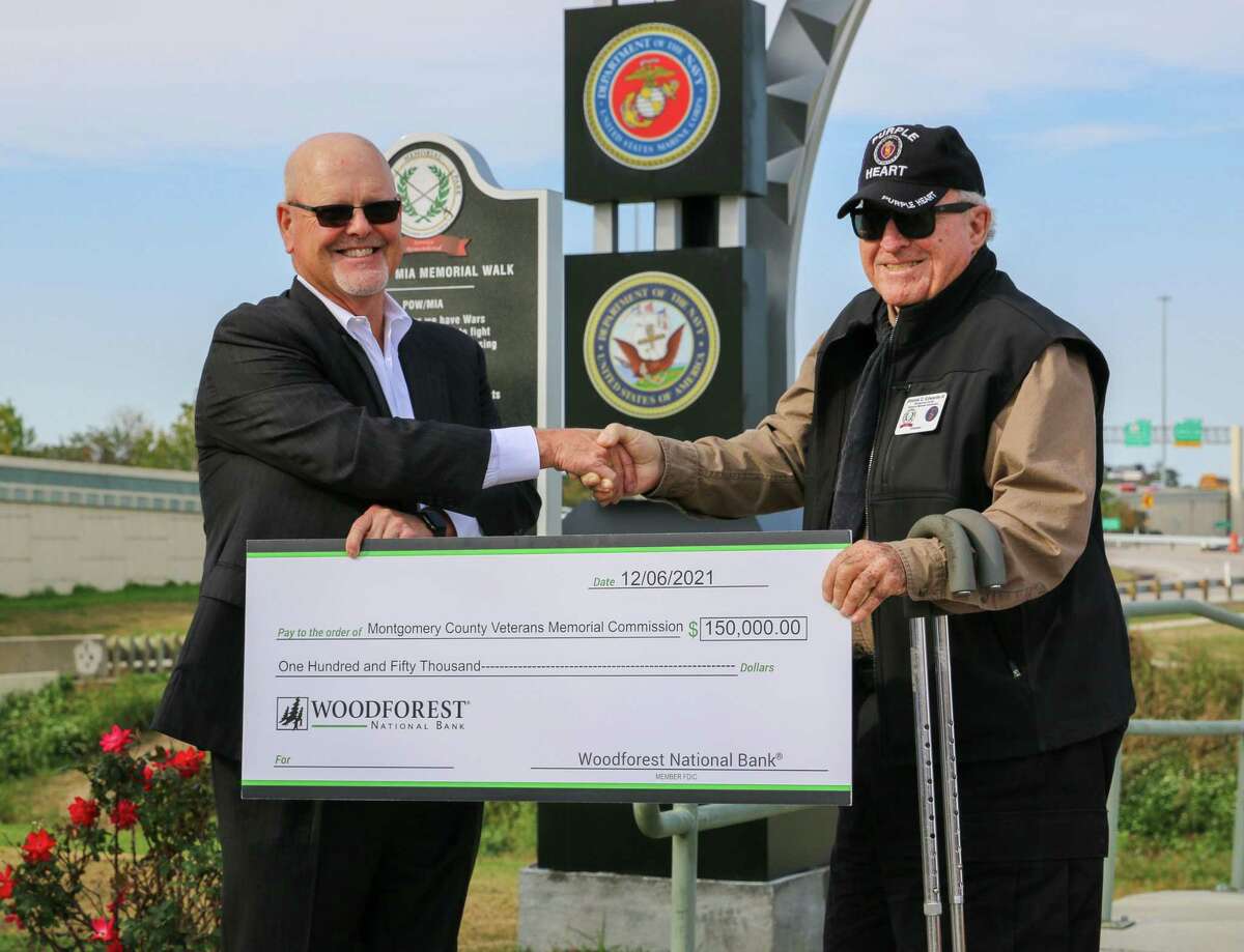To show support for both active military members and military veterans, Woodforest National Bank recently donated $150,000 to the Montgomery County Veterans Memorial Park. Pictured during the presentation ceremony are Woodforest National Bank President and CEO Jay Dreibelbis, left, and Montgomery County Veterans Memorial Commission Chairman Jimmie C. Edwards III.