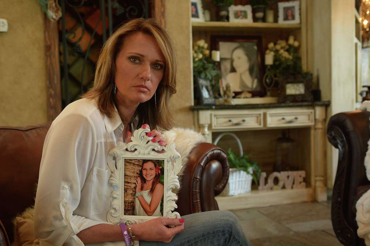 Kim Hess, at her home in The Woodlands, holds a photo of her daughter Cassidy, a student and varsity cheerleader at College Park High School who committed suicide in December 2015. In 2016, the Hess family created the Cassidy Joined for Hope Foundation with the mission to prevent teen suicide in memory of Cassidy.