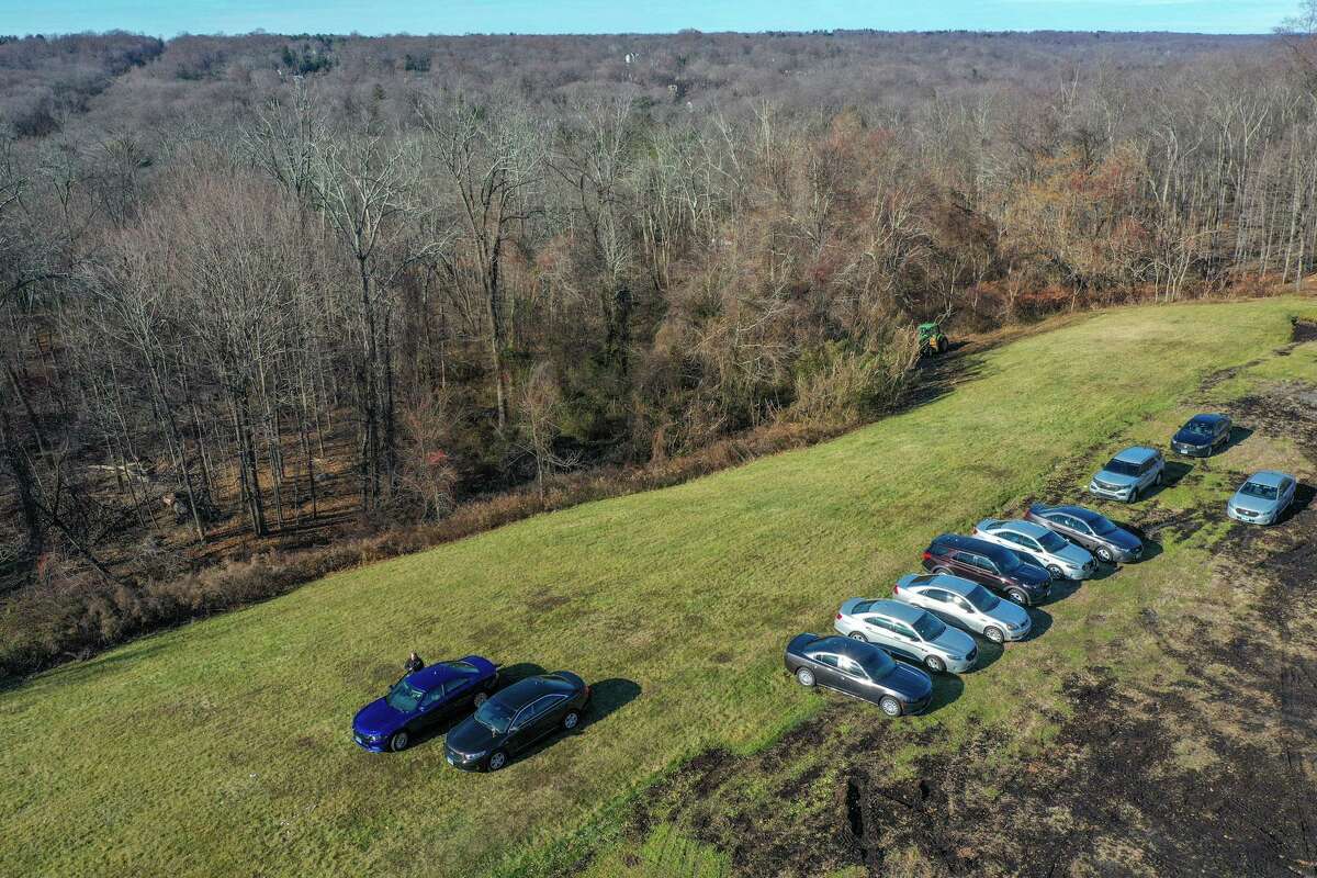 State police search an area of New Canaan town property adjacent to Waveny Park in connection with the Jennifer Dulos case on Monday, Dec. 20, 2021.