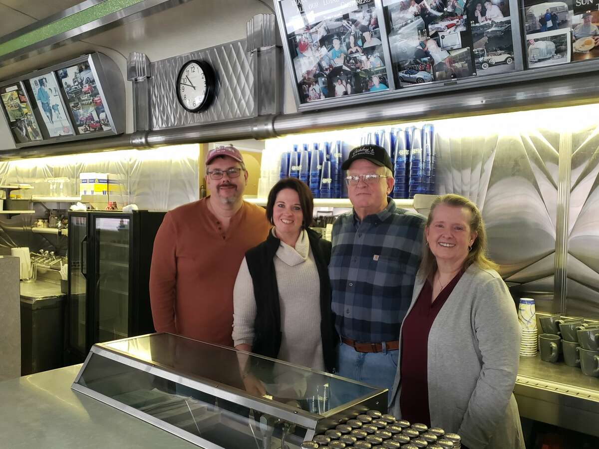 Lenny and Eva Youker stand with Eva's parents, Glen and Colleen Glindmeyer, behind the counter of Gibby's Diner. The family has owned the diner since 1952. 