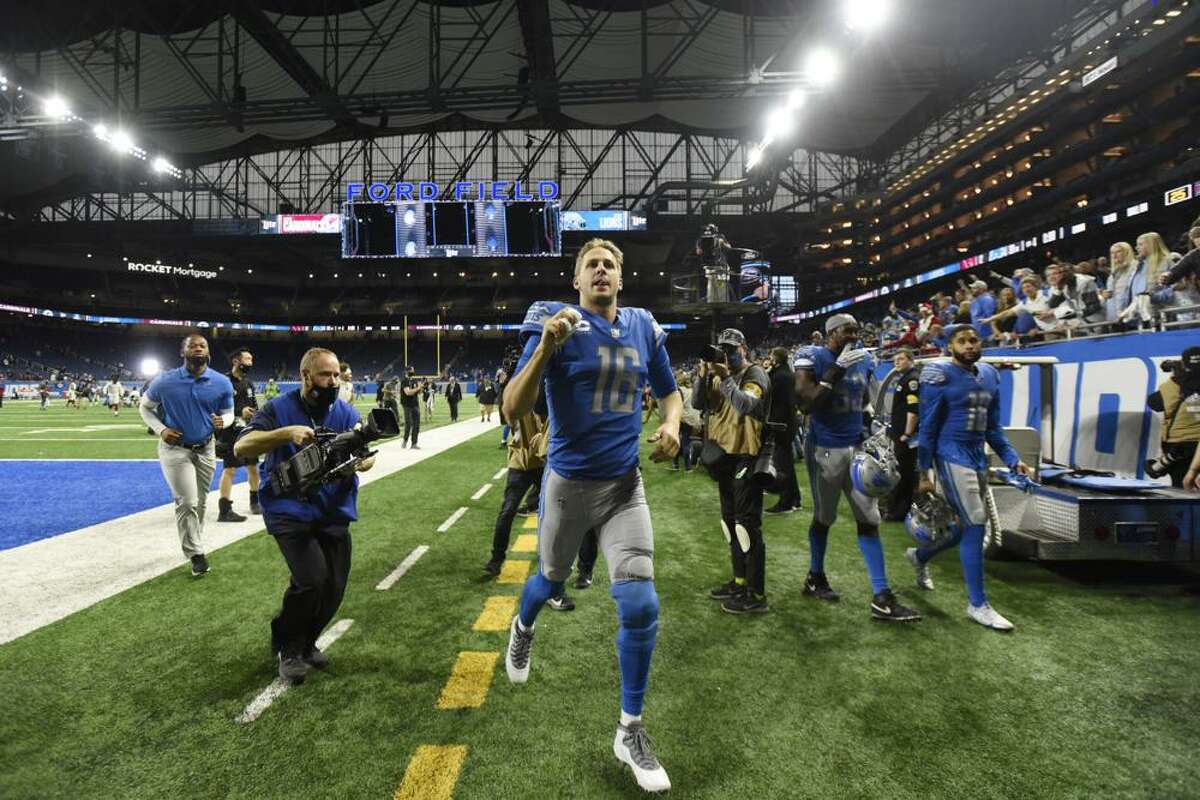 Detroit Lions quarterback Jared Goff runs off the field after the second half of an NFL football game against the Arizona Cardinals, Sunday, Dec. 19, 2021, in Detroit.