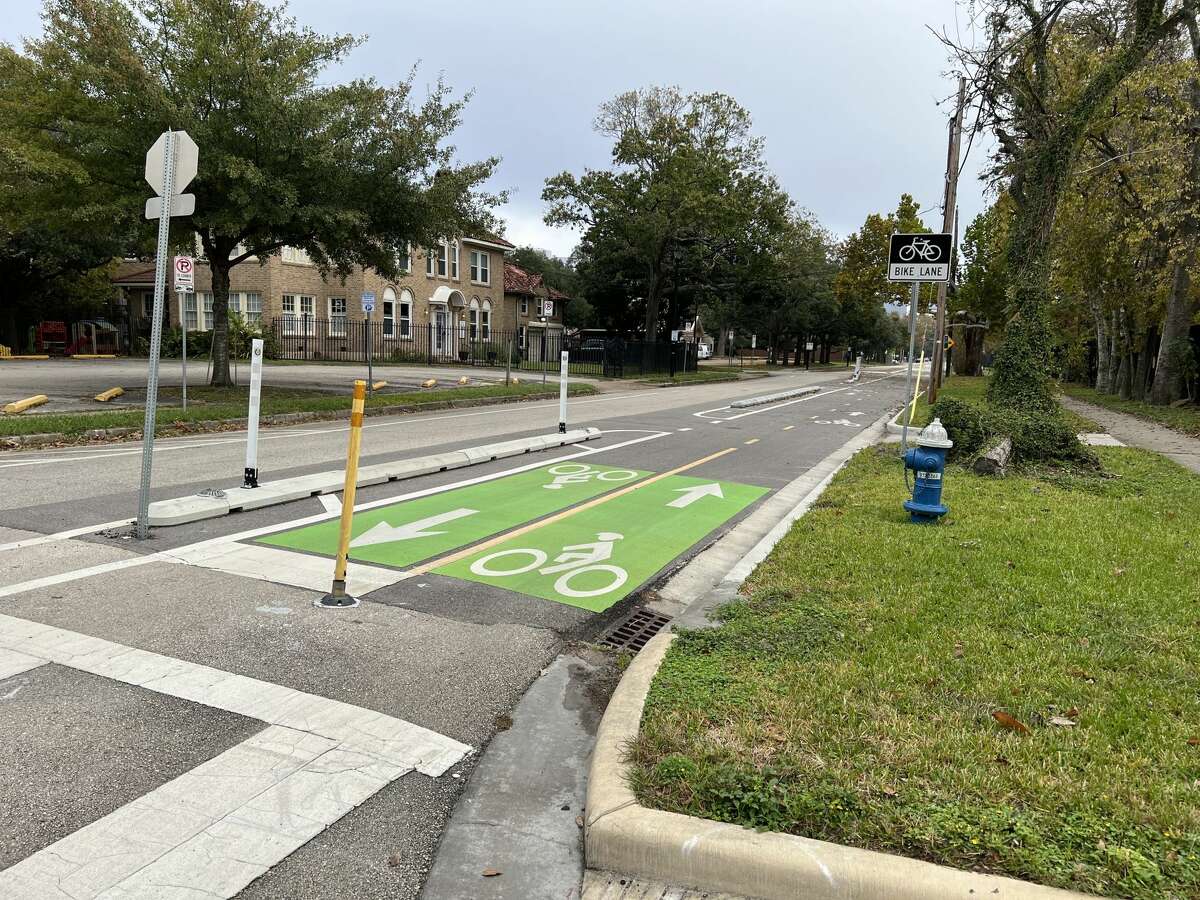 A new bike lane along Austin Street provides a protected thoroughfare for cyclists. 
