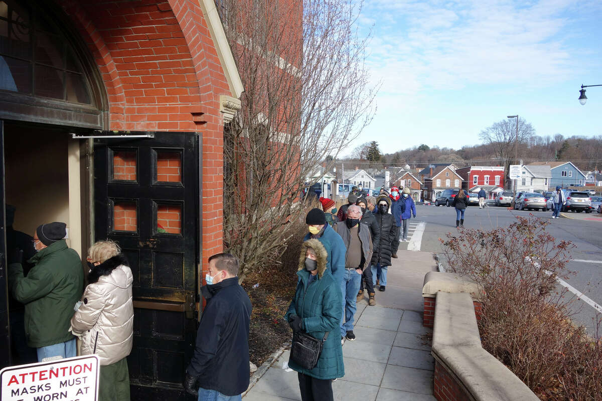 A line of residents waiting to receive a COVID-19 test kit stretched outside Kingston City Hall and around the building on the first day of kit distribution on Dec. 20, 2021. The city ran out of its 850 tests on the first day and had to cancel the planned next two days of distribution.