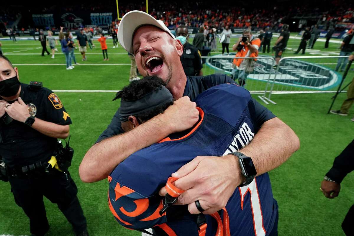 UTSA head coach Jeff Traylor celebrates his team's win over Western Kentucky with safety Dadrian Taylor (7) in an NCAA college football game in the Conference USA Championship, Friday, Dec. 3, 2021, in San Antonio. 