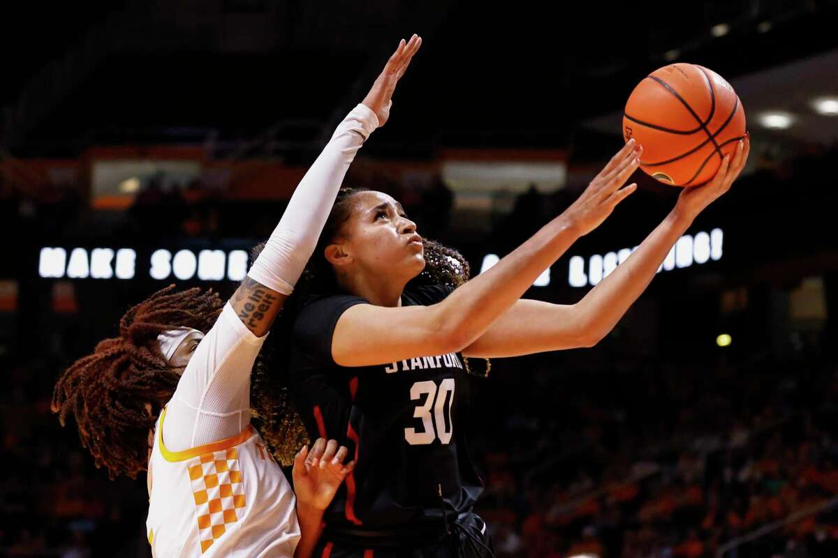 Stanford guard Haley Jones (30) shoots past Tennessee forward Alexus Dye (2) during the first half of an NCAA college basketball game Saturday, Dec. 18, 2021, in Knoxville, TN. (AP Photo/Wade Payne)