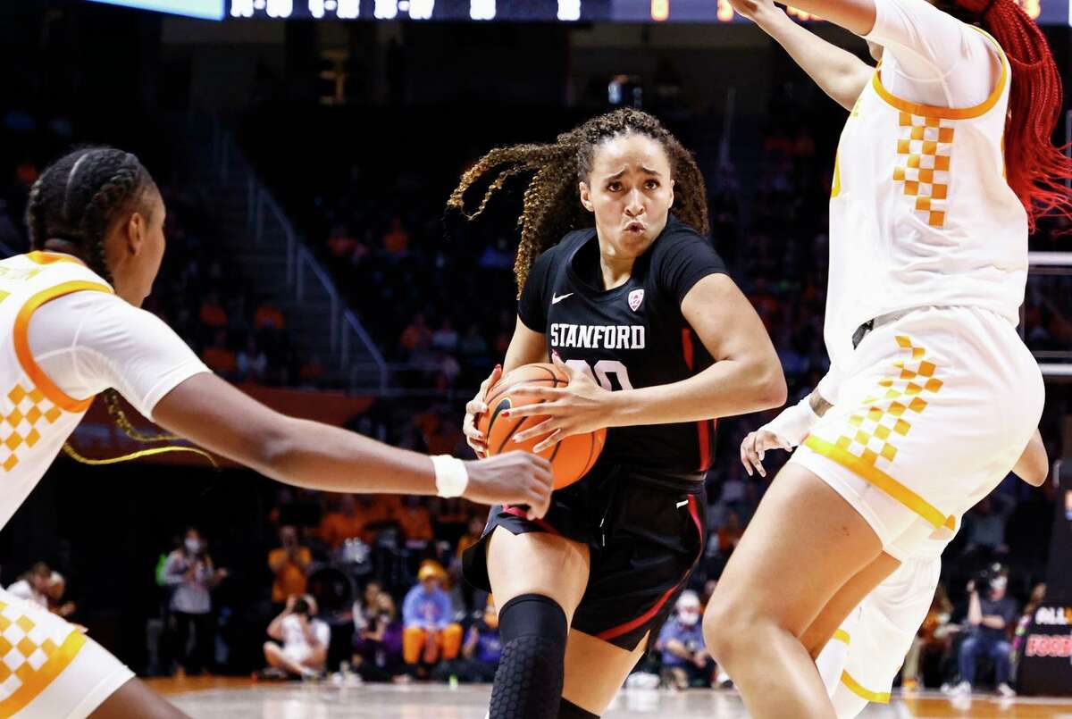 Stanford guard Haley Jones drives between two Tennessee defenders in the Cardinal’s 74-63 win Saturday. Jones had 18 points, 19 rebounds and six assists as Stanford improved to 8-2.