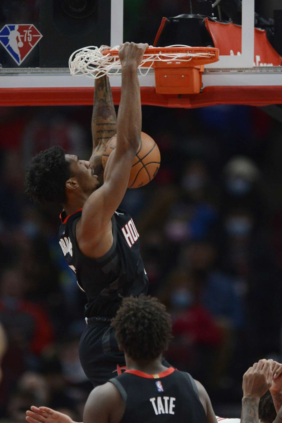 Houston Rockets guard Armoni Brooks (7) dunks during the second half of an NBA basketball game against the Chicago Bulls, Monday, Dec. 20, 2021, in Chicago. (AP Photo/Paul Beaty)