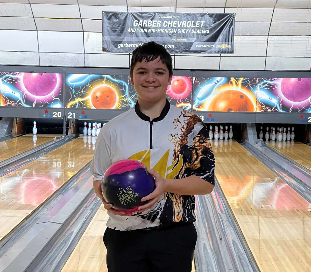 Midland's Evan Daly poses with his ball in this undated photo. Daly, a freshman member of Midland High's boys' bowling team, recently threw a 300 game and a 730 series while competing in youth leagues at Northern Lanes.