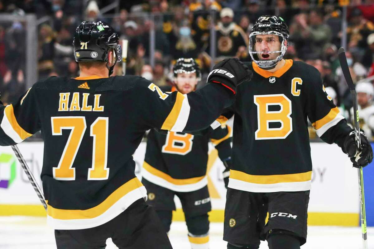 Patrice Bergeron of the Boston Bruins reacts after scoring a goal in the third period of a game against the Vegas Golden Knights at TD Garden on December 14, 2021 in Boston, Massachusetts.