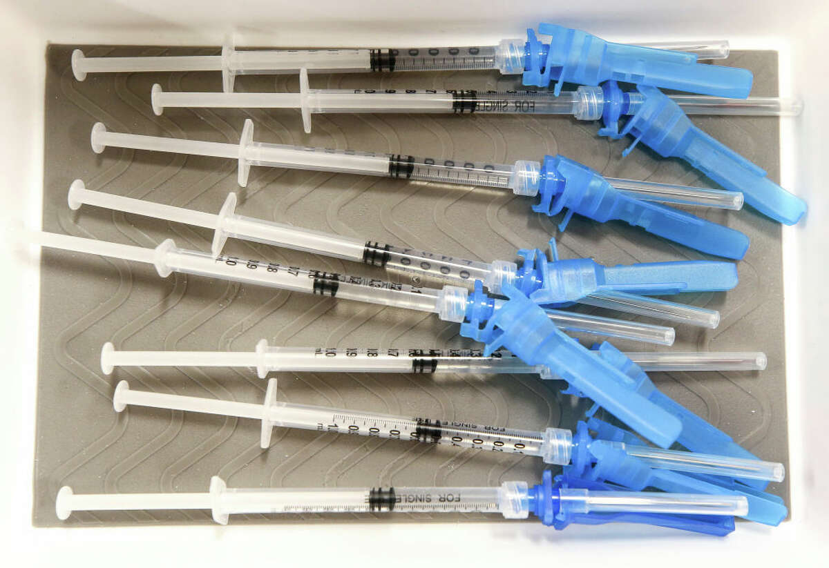 Syringes containing a dose of the new one-shot Johnson & Johnson COVID-19 vaccine. (Photo by Mario Tama/Getty Images)