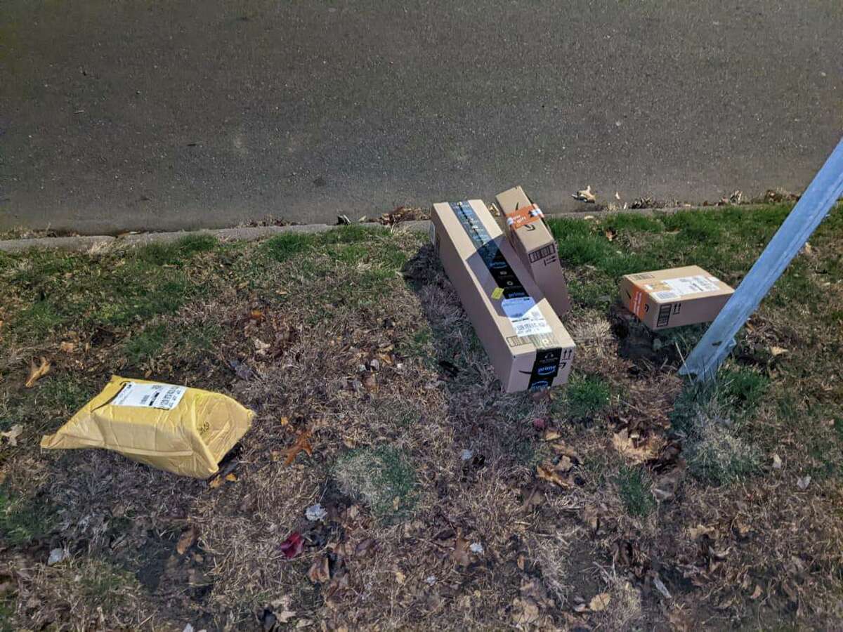 Amazon packages left curbside on Atwater Street in West Haven, some blocks away from their intended recipients.