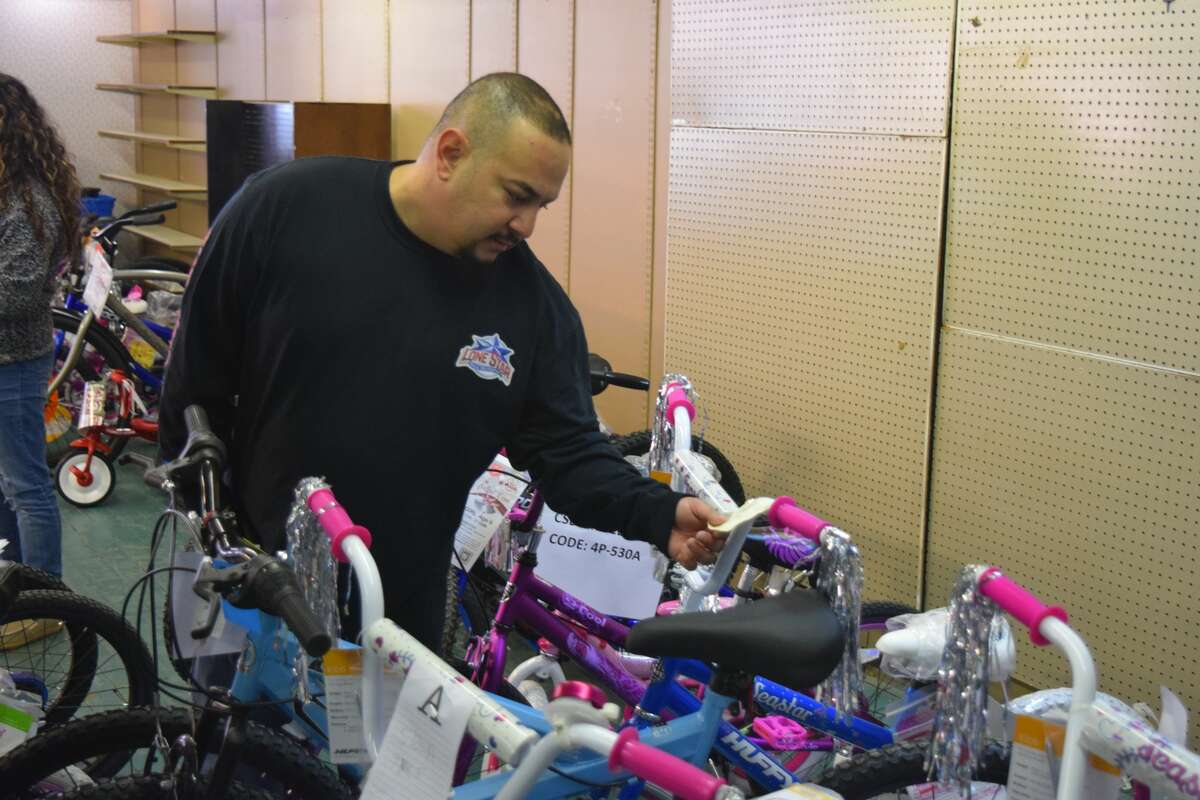 Salvation Army volunteers gathered Saturday morning to sort through clothes and toys to be distributed to this year's Angel Tree recipients.