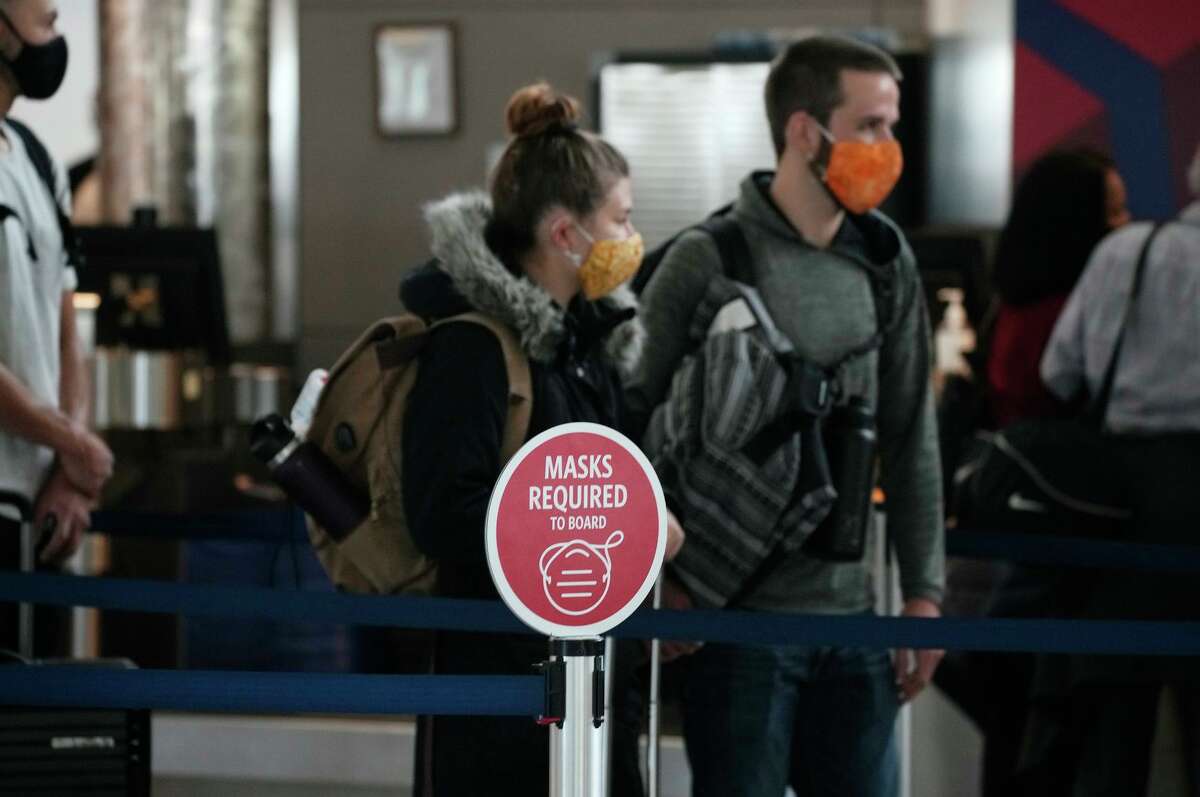 Masks are a requirement at Denver International Airport and other U.S. airports but most domestic airline passengers do not need to be vaccinated or have a negative coronavirus test.