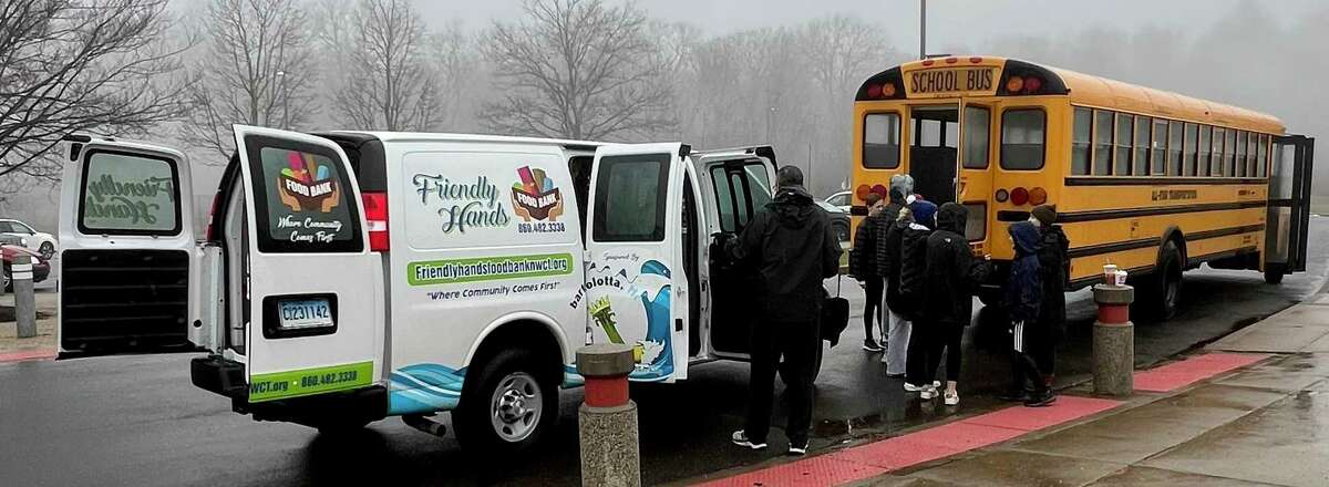 Lewis S. Mills High School students filled a bus with donations for Friendly Hands Food Bank in Torrington.