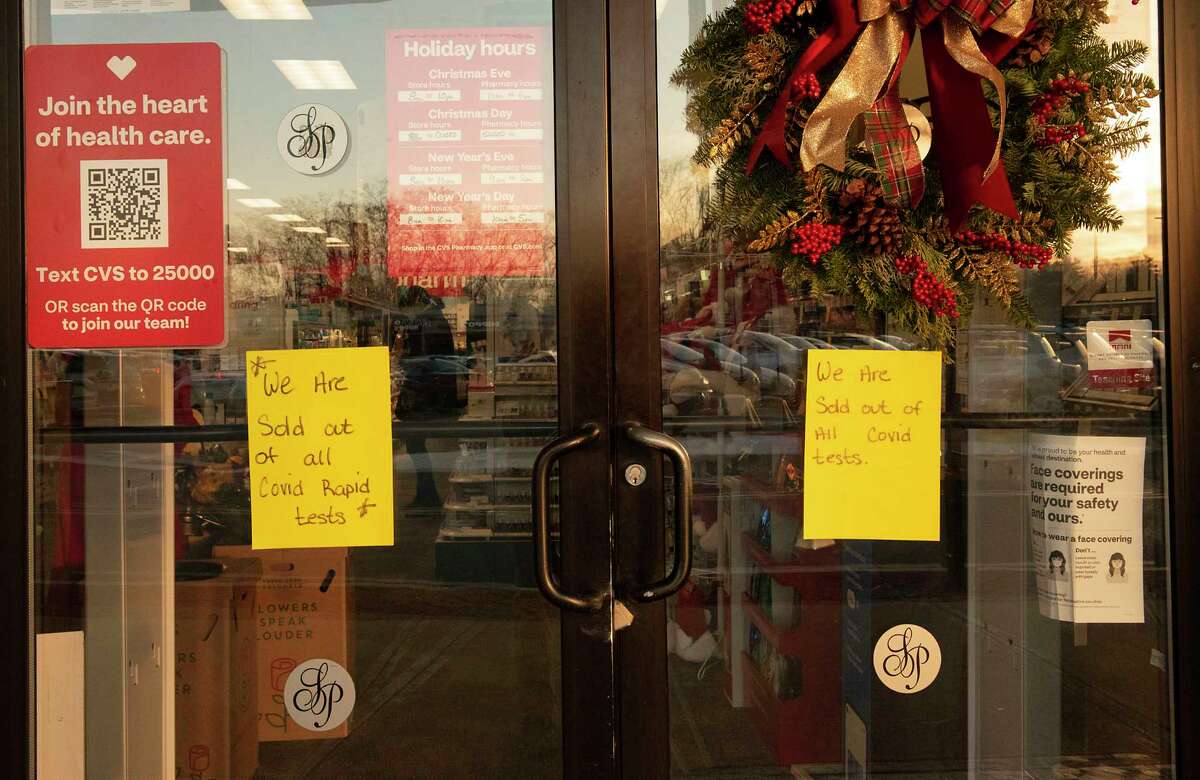 Signs informing customers they are sold out of the COVID rapid test are seen on the door of the CVS in Stuyvesant Plaza on Tuesday, Dec. 21, 2021 in Albany, N.Y