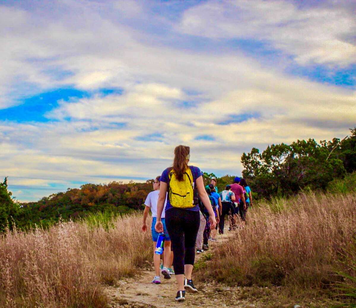 Members of the Girls Who Hike TX group hike in Friedrich Wilderness Park. Women-only hiking groups provide a safe space where women can enjoy themselves without being judged by men.